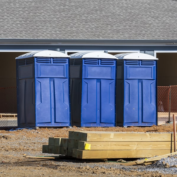 what is the cost difference between standard and deluxe porta potty rentals in Ogilvie Minnesota